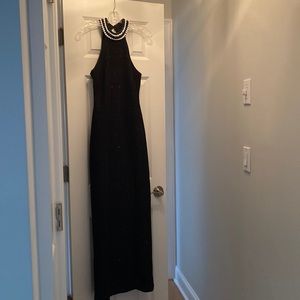 Black, sparkly gown w/ beaded neckline. Floor length.
